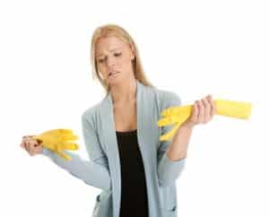Frustrated woman in despair before cleaning